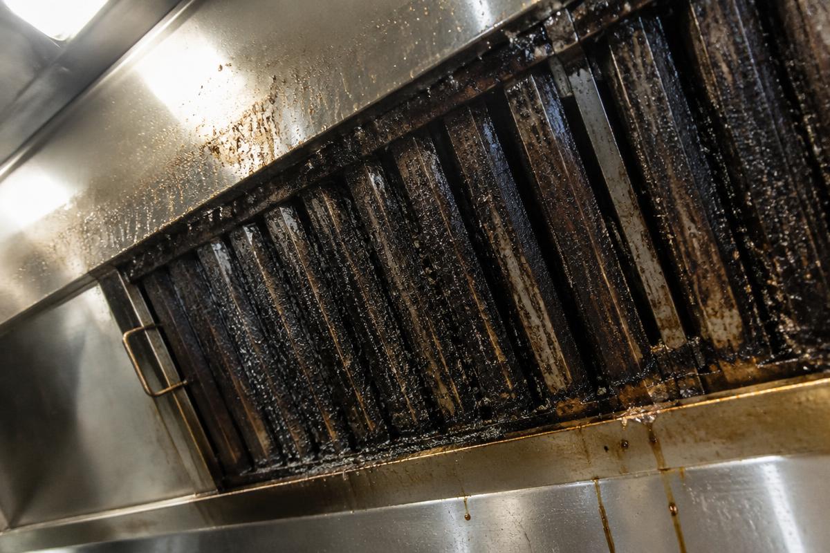 Commercial kitchen hood with heavy grease build-up